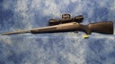 USED TIKKA MODEL 595 SYNTHETIC 243 WIN SS 22" BBL W/SCOPE