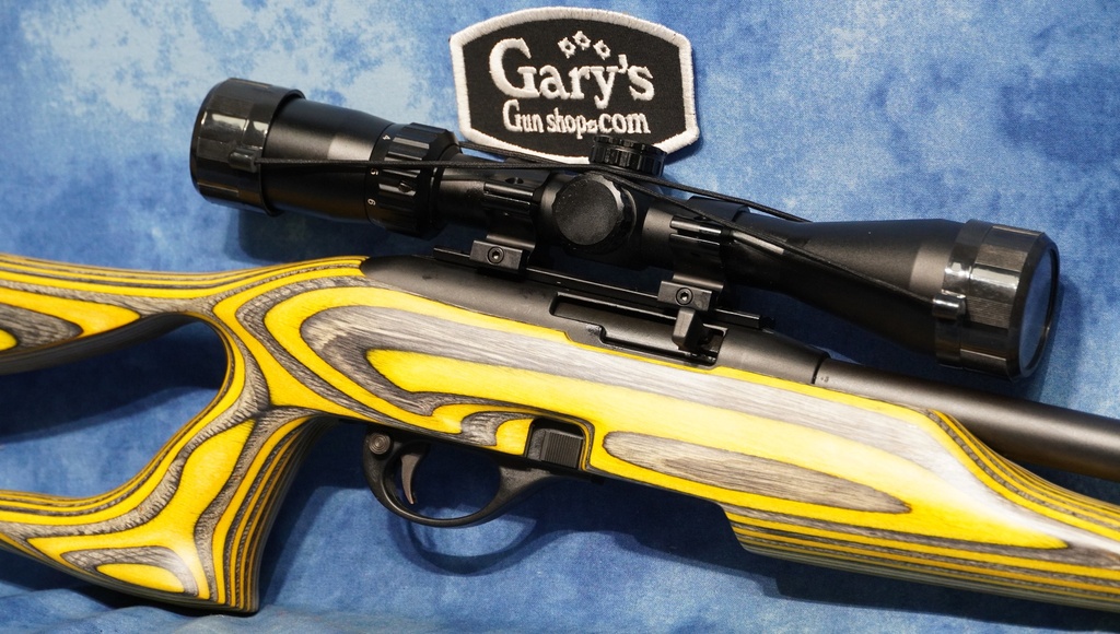 USED REMINGTON 597 22 LR 20" HVY BBL LAMINATE STOCK W/SCOPE